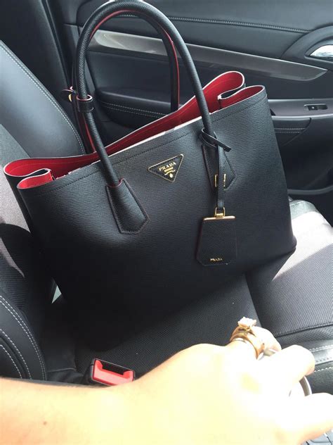 prada black and red bag.